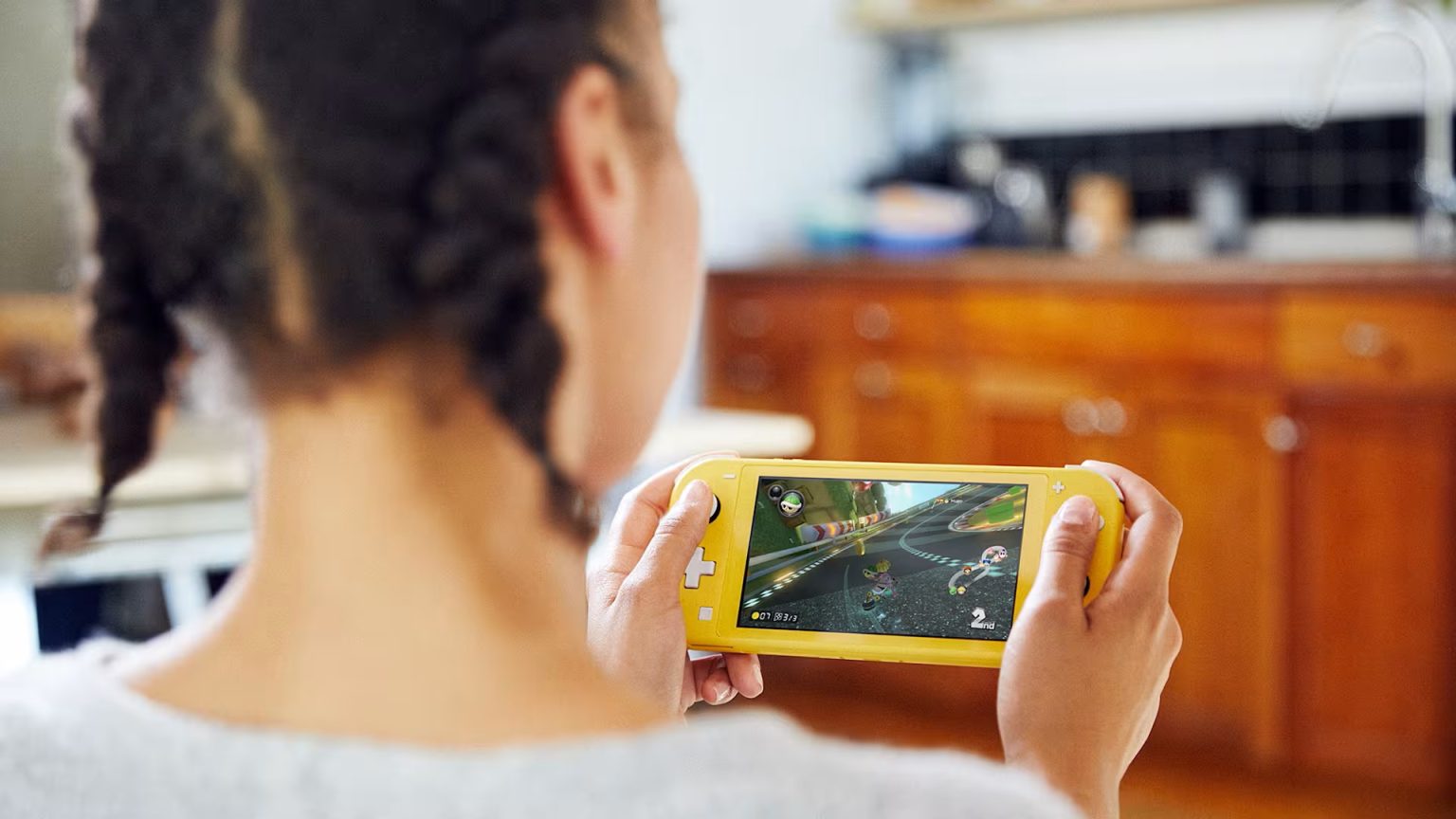 This Week in Gaming News: May 6th – May 12th Someone playing a Nintendo Switch Lite