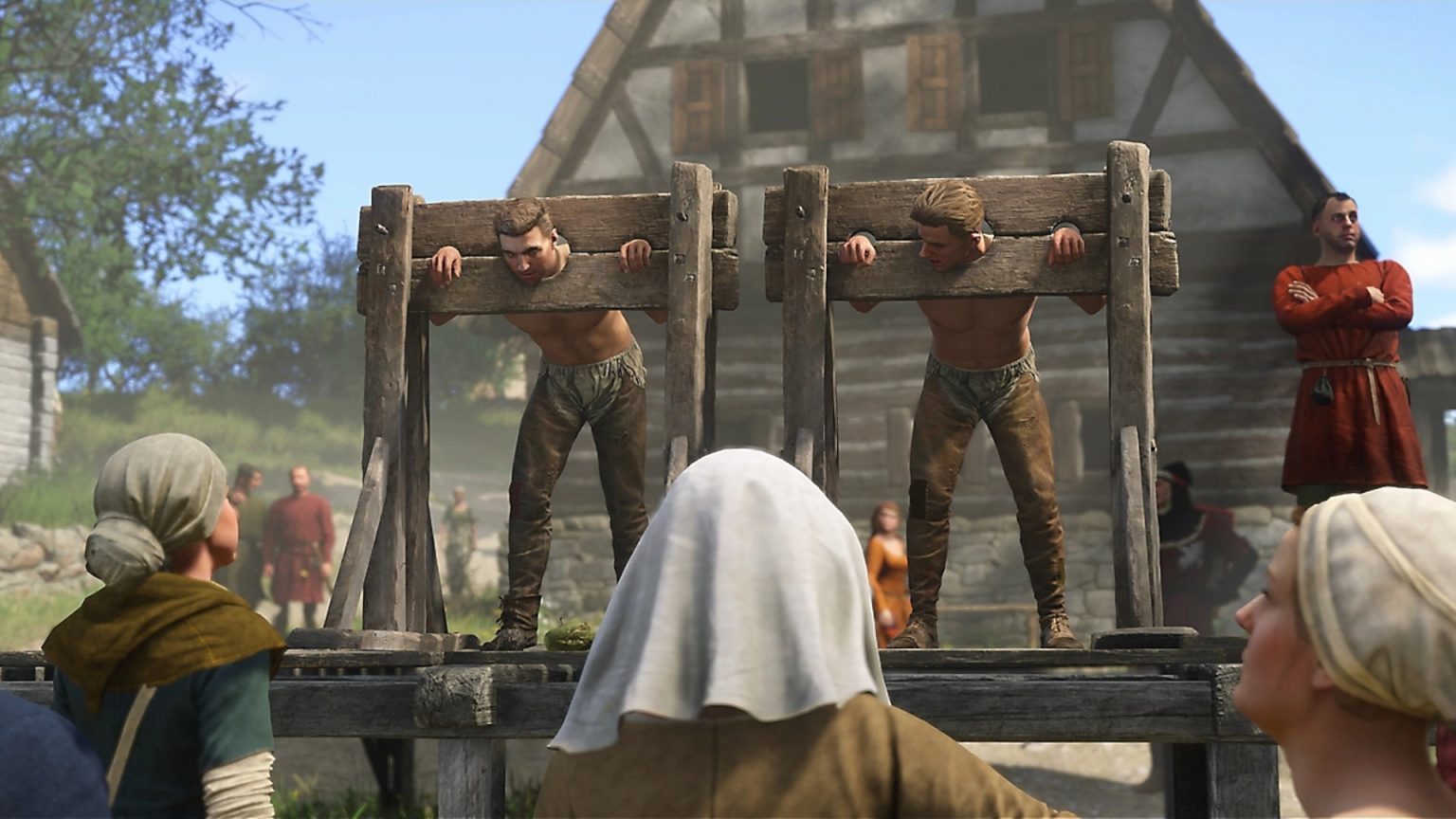 The Best Games for February 2025 Two people in the stocks with a crowd gathered around them in Kingdom Come: Deliverance 2